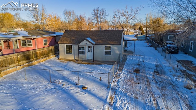 view of snow covered house