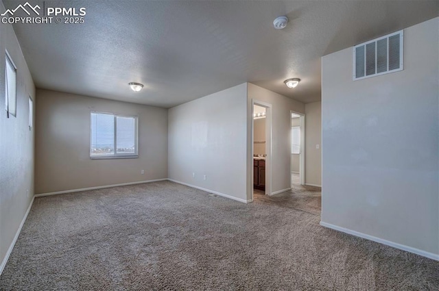 unfurnished room featuring carpet flooring