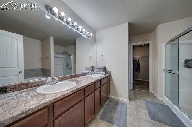 bathroom featuring vanity and separate shower and tub