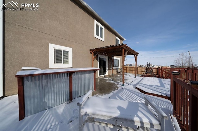 exterior space with a wooden deck and a pergola