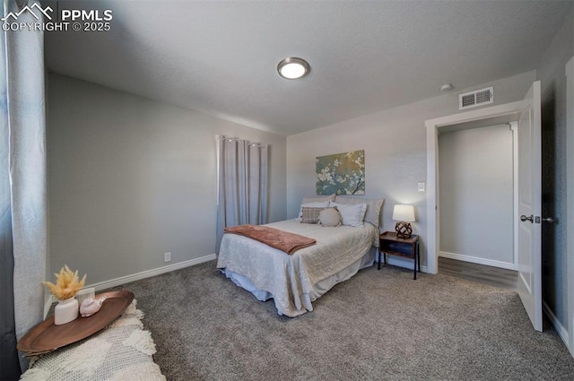 bedroom featuring dark colored carpet