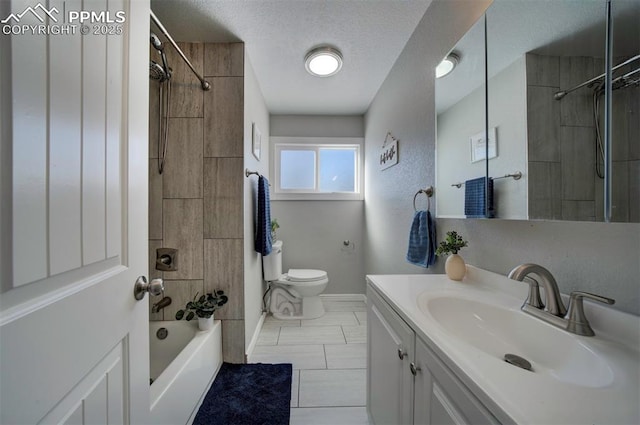 full bathroom featuring tiled shower / bath combo, vanity, tile patterned flooring, toilet, and a textured ceiling