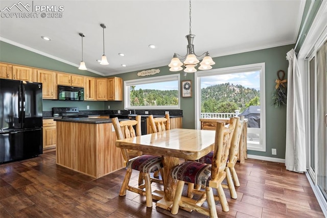 kitchen with pendant lighting, crown molding, and black appliances