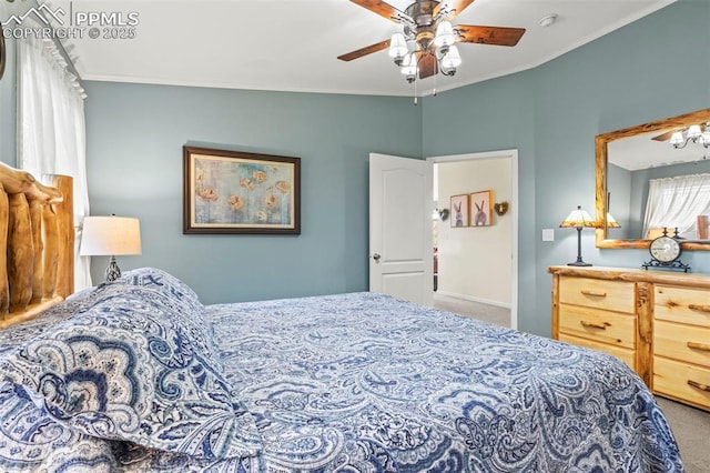 bedroom featuring ornamental molding, carpet floors, and ceiling fan