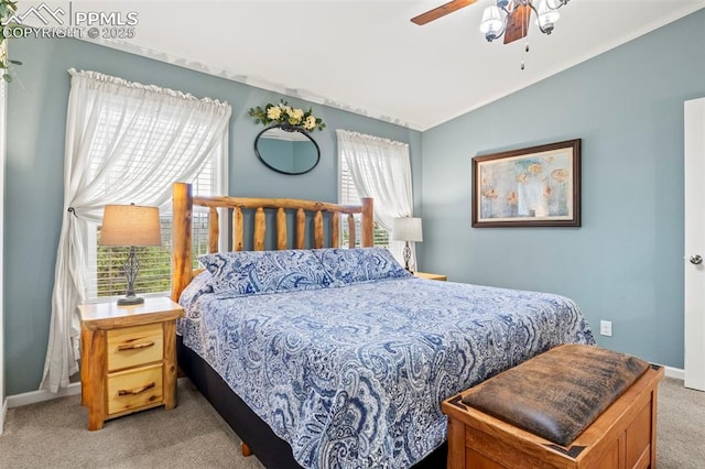 bedroom with vaulted ceiling, light colored carpet, and ceiling fan