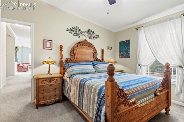 carpeted bedroom with ornamental molding and ceiling fan