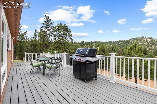 wooden deck with area for grilling