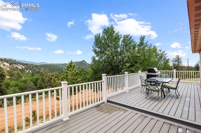 wooden deck featuring a mountain view