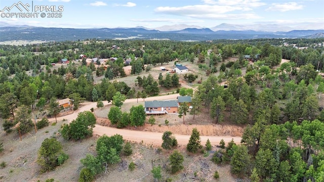 drone / aerial view featuring a mountain view