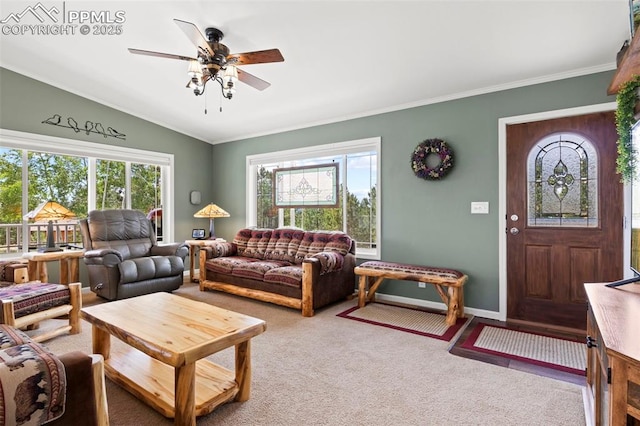 carpeted living room with ceiling fan and ornamental molding