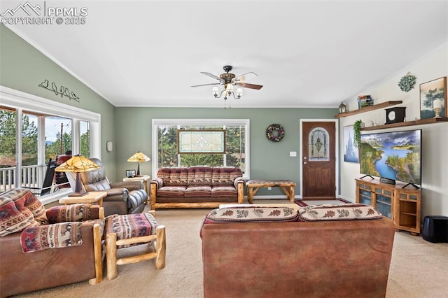 carpeted living room with crown molding, vaulted ceiling, and a healthy amount of sunlight