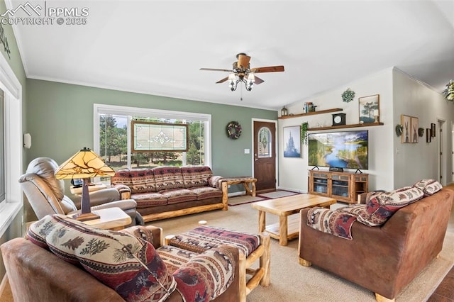 living room with vaulted ceiling, crown molding, light carpet, and ceiling fan