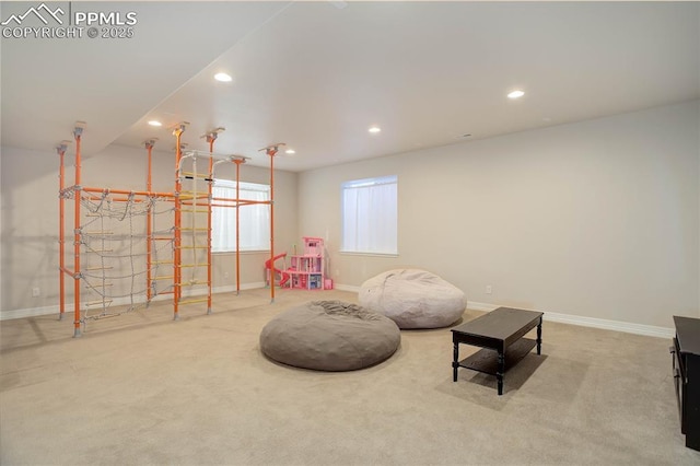 living area featuring carpet, baseboards, and recessed lighting