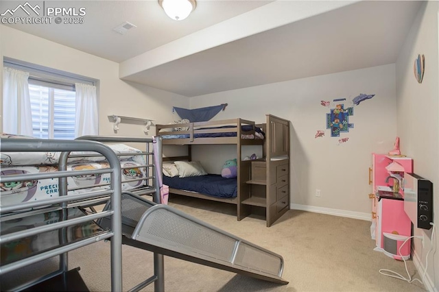 bedroom featuring baseboards, visible vents, and light colored carpet