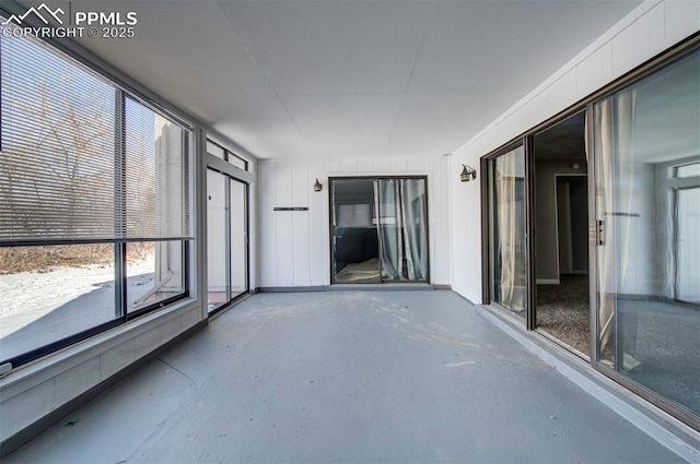 unfurnished sunroom featuring plenty of natural light