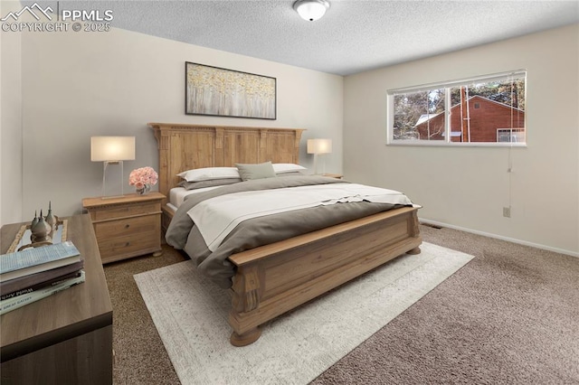 bedroom with carpet flooring and a textured ceiling