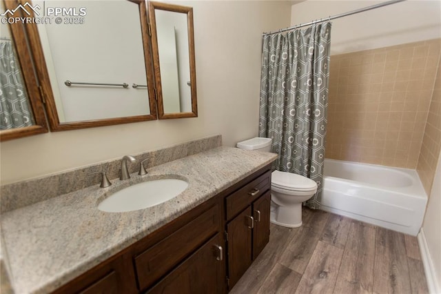 full bathroom featuring hardwood / wood-style flooring, vanity, toilet, and shower / bath combination with curtain