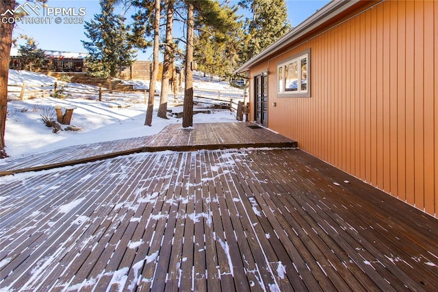 view of snow covered deck