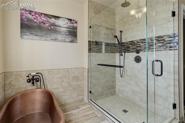 bathroom featuring a shower with shower door