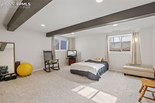 carpeted bedroom featuring beam ceiling