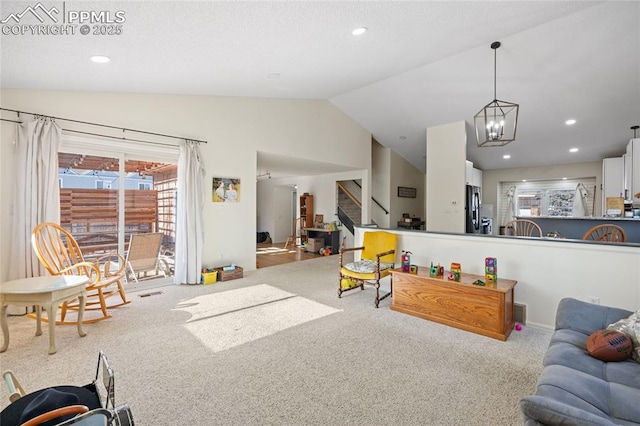 living room featuring lofted ceiling and light colored carpet