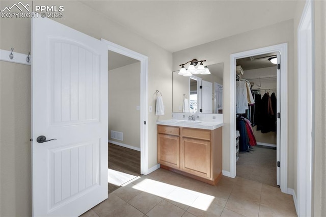 bathroom featuring tile patterned floors and vanity