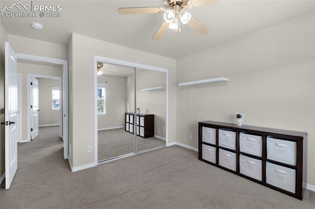 carpeted empty room with ceiling fan