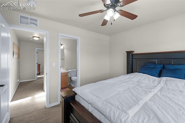 carpeted bedroom featuring ceiling fan and ensuite bathroom