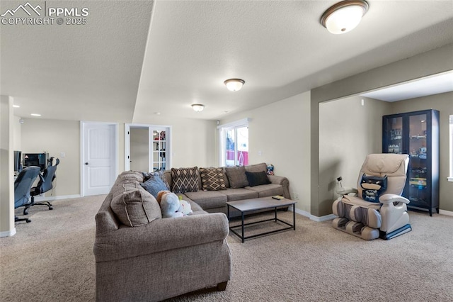 carpeted living room with a textured ceiling