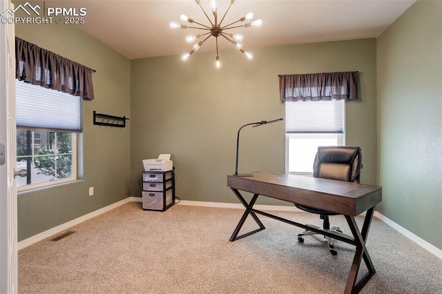 office featuring visible vents, light carpet, a wealth of natural light, and an inviting chandelier