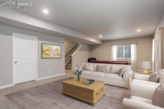 living area with stairway, baseboards, recessed lighting, and light colored carpet