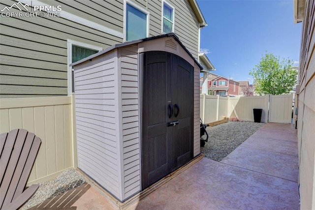 view of shed with a fenced backyard