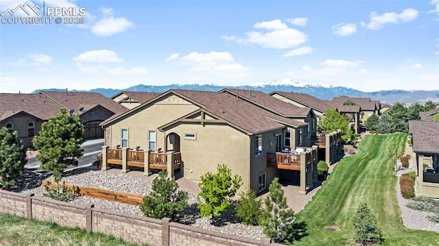 rear view of house with a mountain view