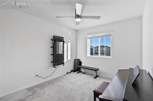 workout room with light carpet and ceiling fan