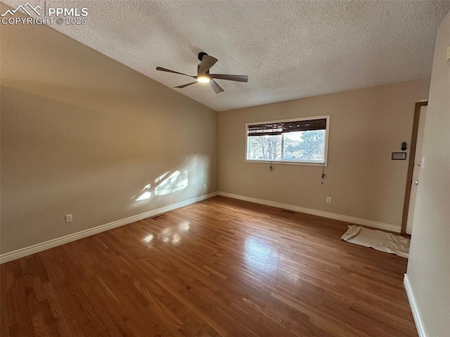 unfurnished room featuring ceiling fan, wood-type flooring, and a textured ceiling