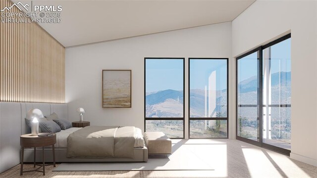 bedroom with light carpet, a mountain view, vaulted ceiling, and multiple windows