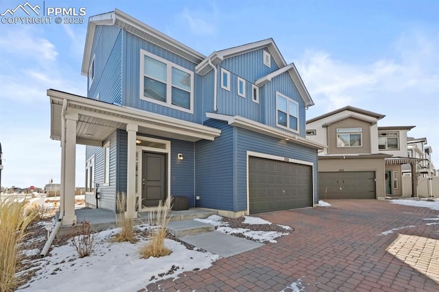 view of front of property with a garage and covered porch