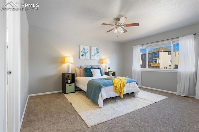 bedroom featuring ceiling fan and carpet flooring