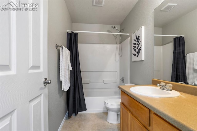 full bathroom featuring vanity, shower / bath combination with curtain, and toilet