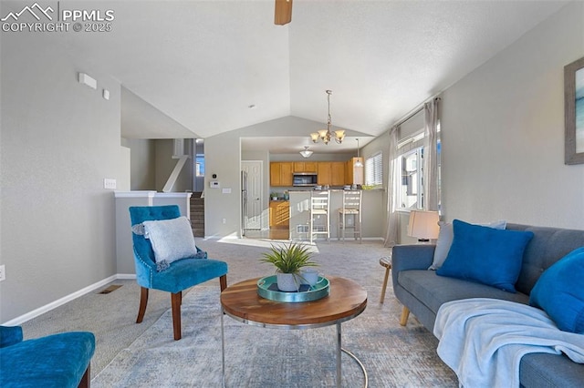 carpeted living room with an inviting chandelier and vaulted ceiling