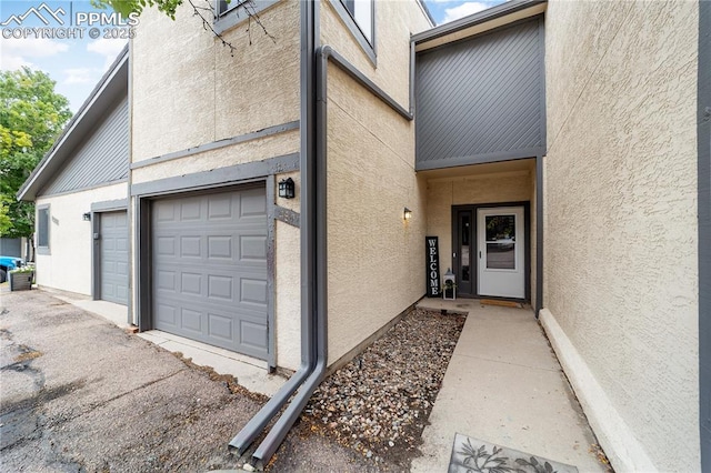 doorway to property featuring a garage