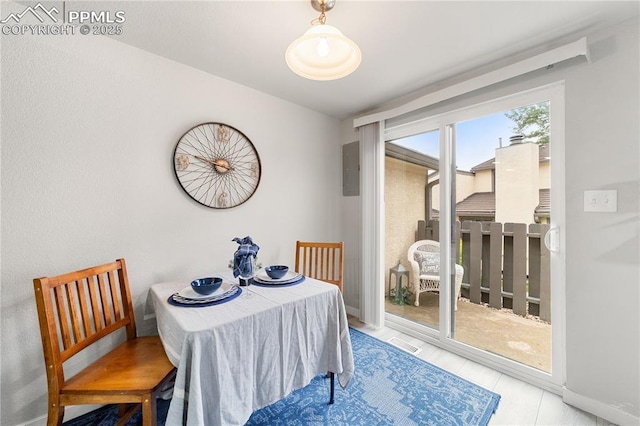 dining area featuring electric panel