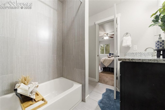 bathroom featuring tile patterned flooring, vanity, and shower / bathing tub combination