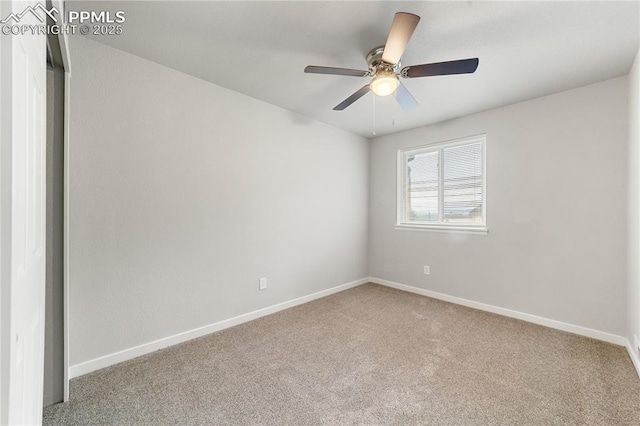 unfurnished room featuring ceiling fan and light carpet