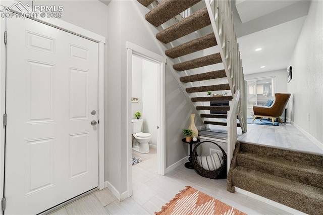 foyer entrance with tile patterned floors