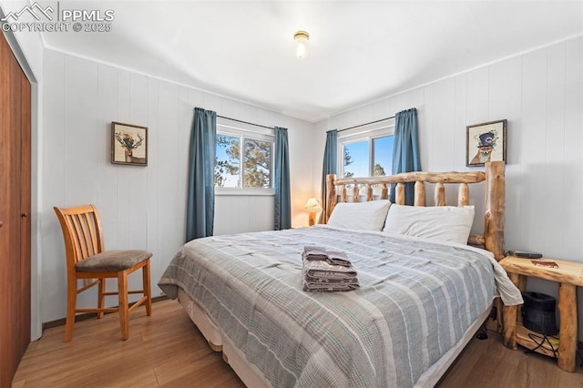 bedroom featuring light hardwood / wood-style flooring and a closet