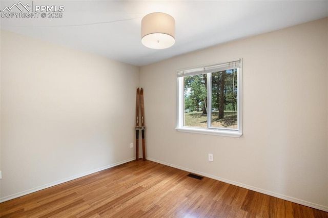 empty room with light wood-type flooring