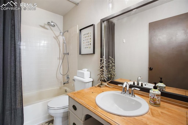 full bathroom with vanity, shower / tub combo, and toilet