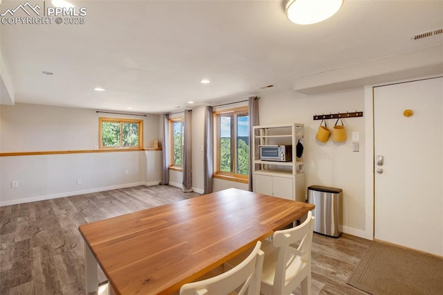 dining area featuring light wood-type flooring