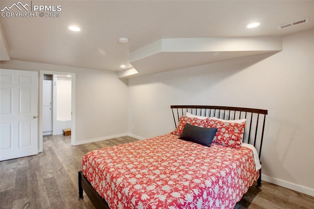 bedroom with wood-type flooring